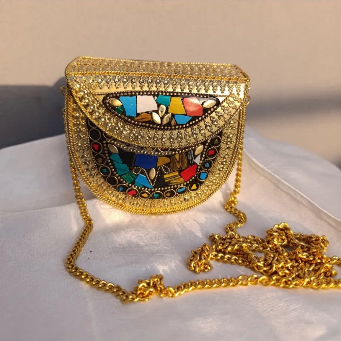 Aaina Clutch
